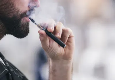 young man vaping young man vaping